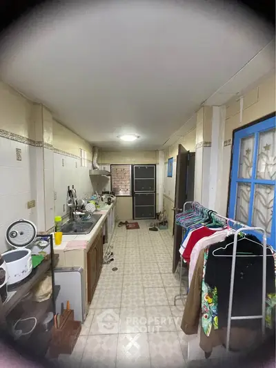 Spacious kitchen with closed layout and ample storage space