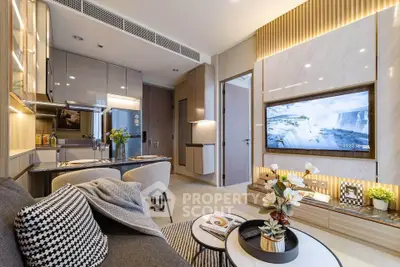 Modern living room with open kitchen, stylish decor, and wall-mounted TV in a contemporary apartment.