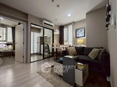 Modern living room with cozy sofa and dining area in stylish apartment