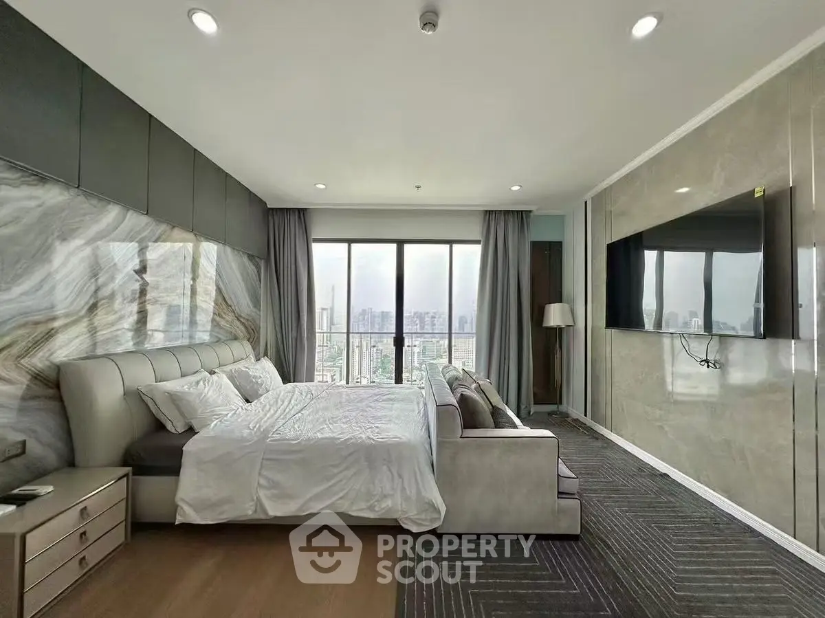 Luxurious bedroom with stunning city view and modern decor