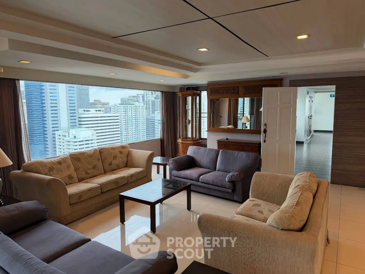 Spacious living room with city view in modern high-rise apartment