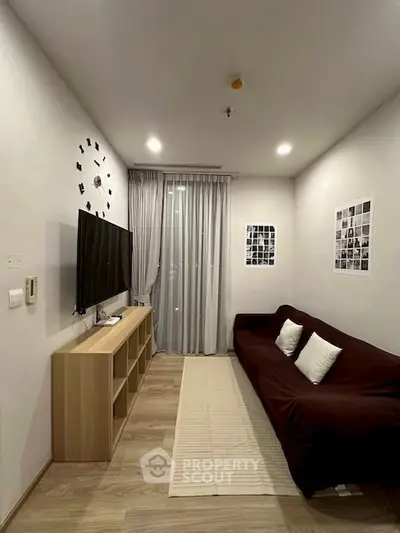 Modern living room with wall-mounted TV and stylish decor
