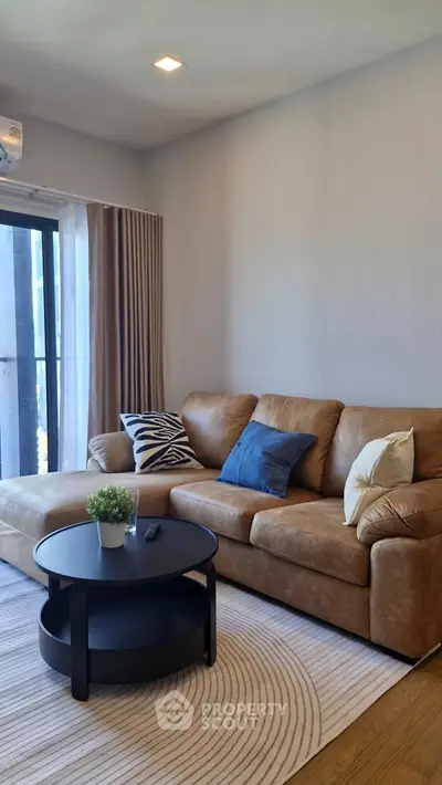 Cozy living room with modern brown sofa and stylish decor