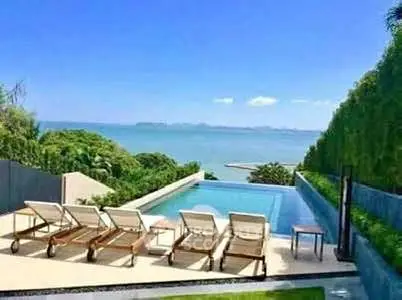 Luxurious beachfront property with stunning infinity pool and ocean view.