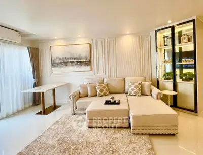 Luxurious living room with elegant decor and plush seating in modern apartment.