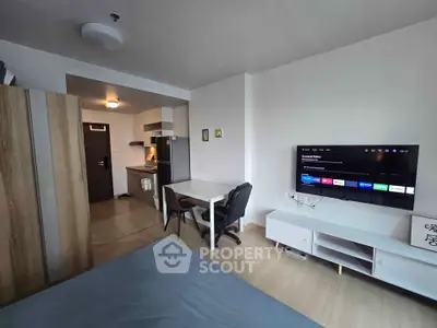 Modern studio apartment with open kitchen and stylish furnishings
