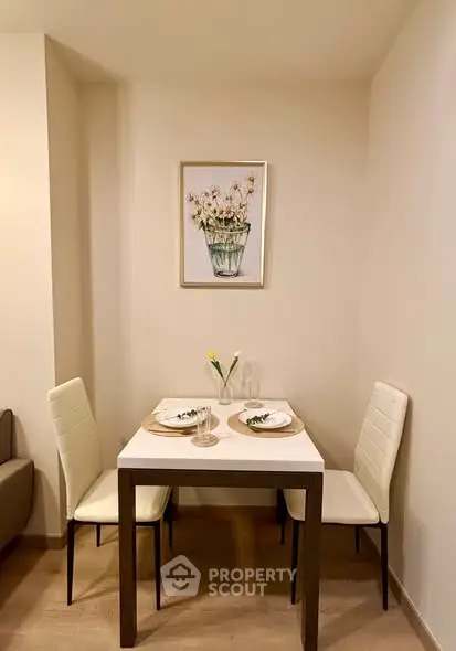 Cozy dining nook with elegant decor and modern furniture in a stylish apartment.