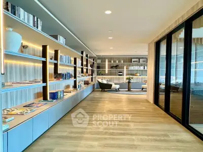 Luxurious modern living room with floor-to-ceiling windows and elegant built-in bookshelves.