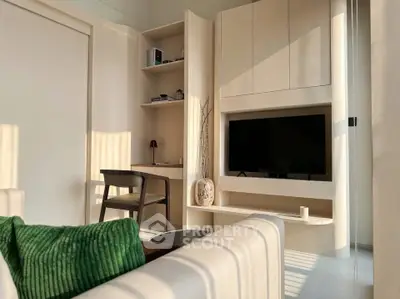 Modern living room with built-in TV unit and cozy seating area