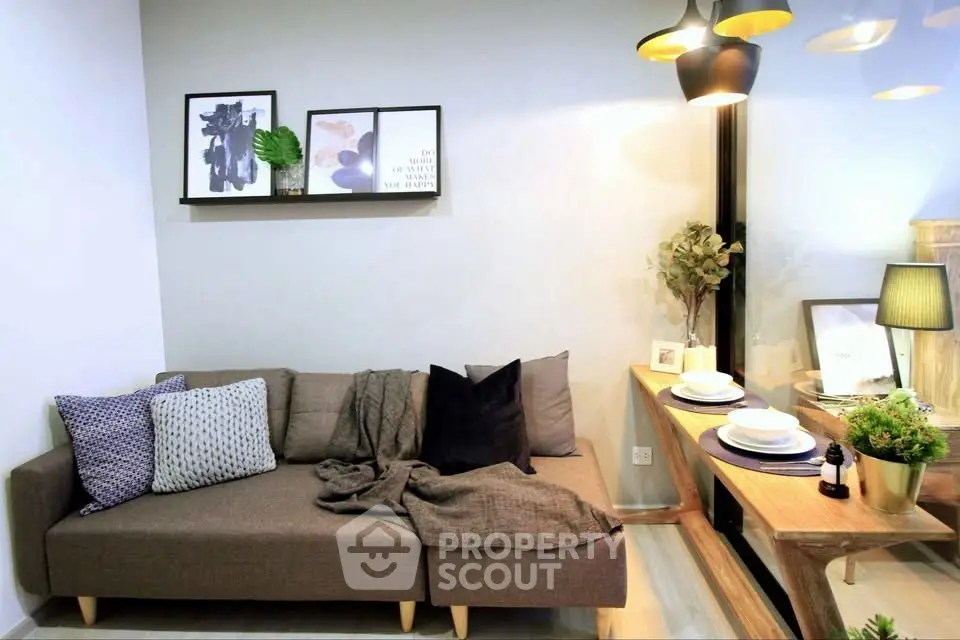 Modern living room with cozy sofa and stylish dining area, perfect for urban living.