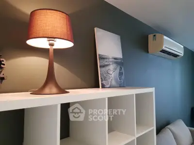 Modern living room with stylish lamp and air conditioning unit