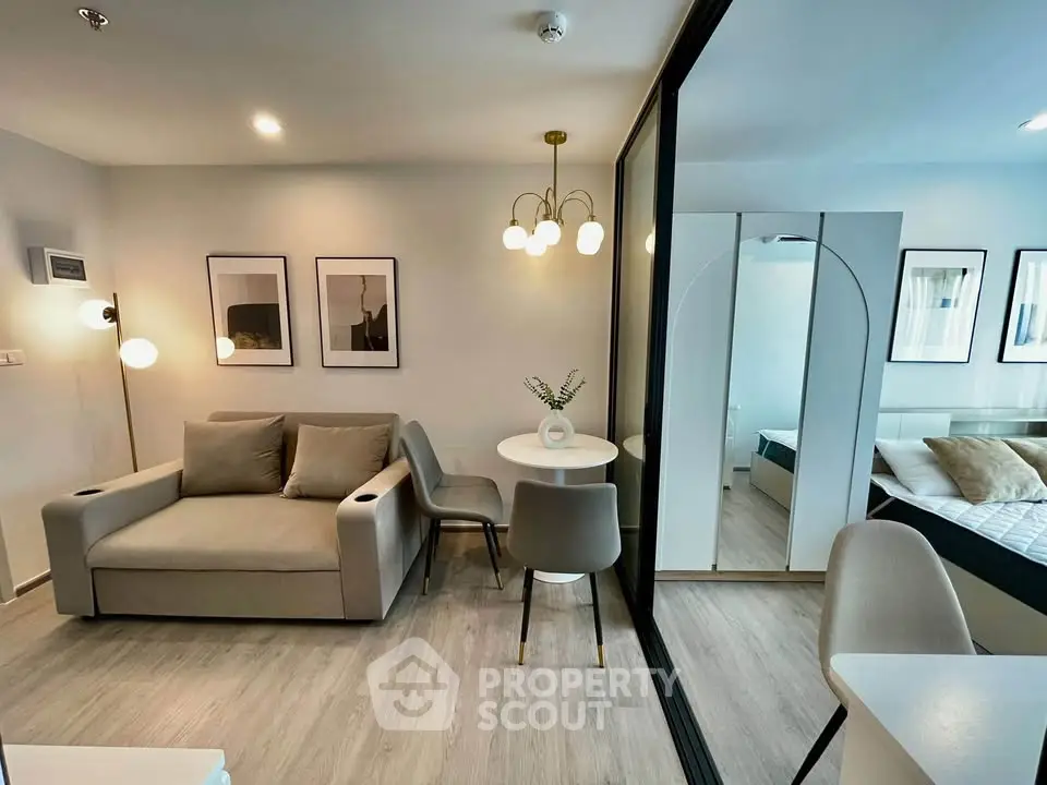 Modern living room with stylish decor and cozy seating area in a contemporary apartment.