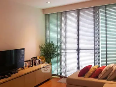 Cozy living room with modern blinds and stylish decor