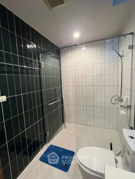 Modern bathroom with sleek glass shower and stylish tile design