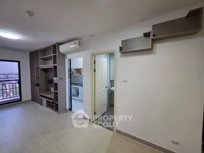 Modern apartment interior with open living space and balcony view