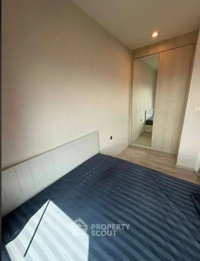 Cozy bedroom with modern design and ample natural light