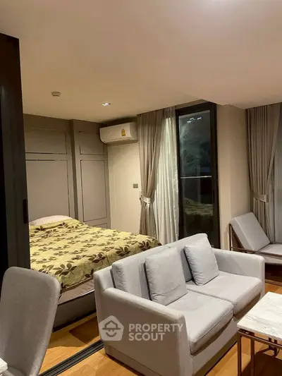 Cozy modern living room with integrated bedroom and stylish furniture