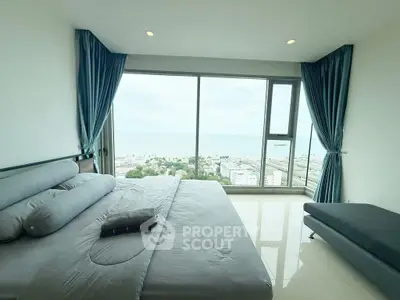 Luxurious bedroom with panoramic ocean view and modern furnishings