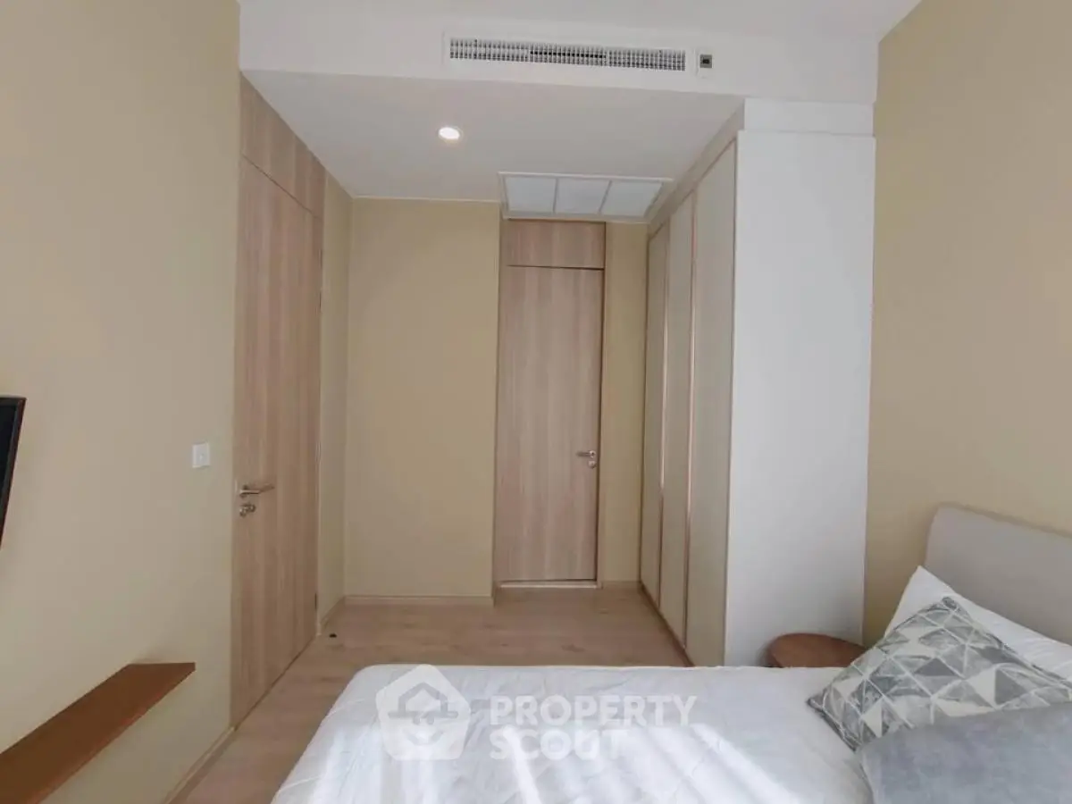 Modern bedroom with minimalist design and neutral tones