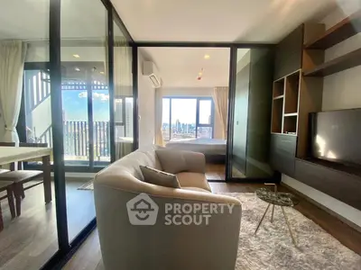 Modern living room with city view and cozy furnishings