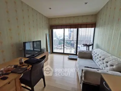 Spacious living room with city view, featuring modern furniture and large windows for natural light.