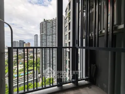 Stunning urban view from a high-rise balcony with modern cityscape.