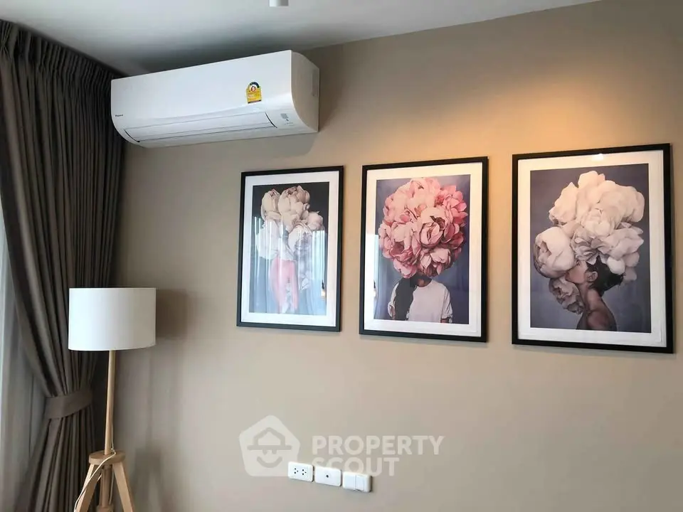 Stylish living room with modern air conditioning and elegant floral artwork