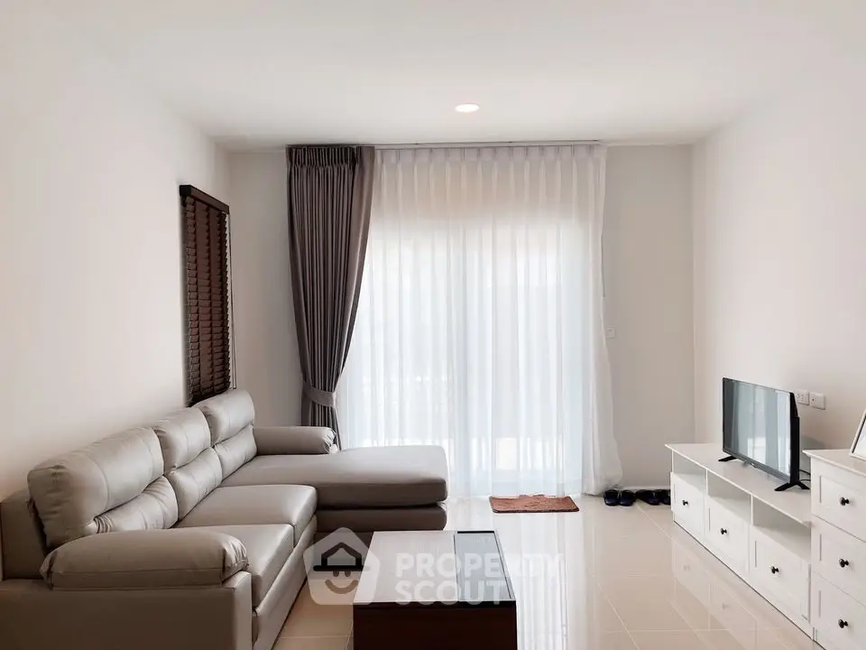 Modern living room with sleek furniture and natural light