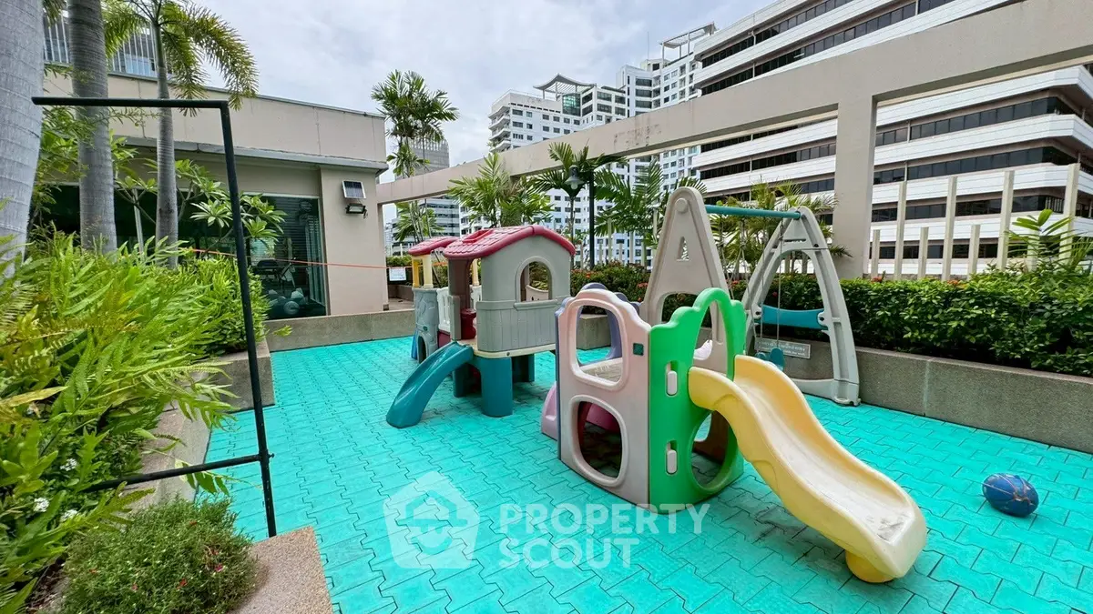 Vibrant rooftop playground with slides and lush greenery in urban setting