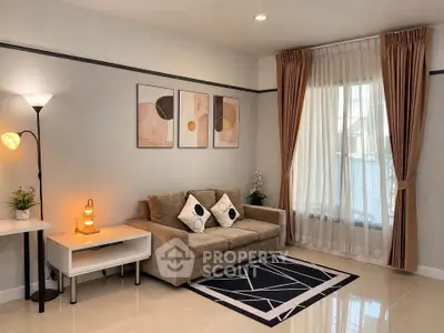 Stylish living room with modern decor and cozy sofa, perfect for relaxation.