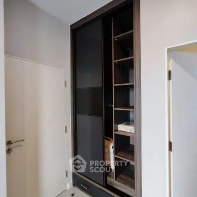 Modern storage unit with sleek design and ample shelving in a contemporary home interior.