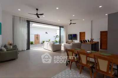 Spacious modern living room with open layout and stylish furniture, perfect for entertaining guests.
