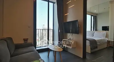 Modern apartment with city view, cozy living area and bedroom