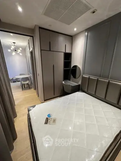 Modern bedroom with sleek design and built-in wardrobe