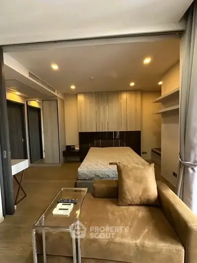 Modern bedroom with cozy seating area and stylish decor