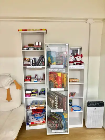 Cozy living room with stylish white shelving and air purifier