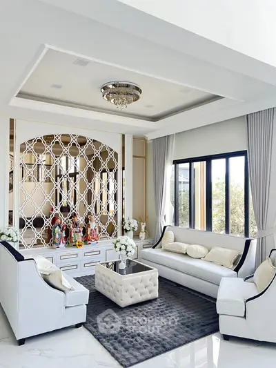 Luxurious living room with elegant decor and plush seating in a modern home.