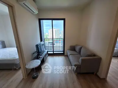 Modern living room with balcony view in urban apartment