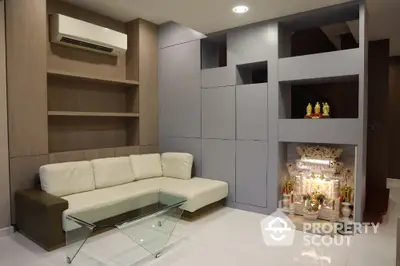 Modern living room with built-in shelves and cozy seating area