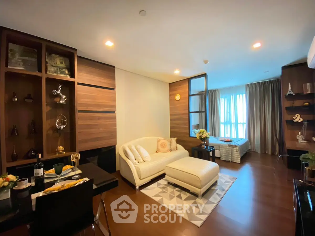 Luxurious open-plan living room with elegant decor and cozy seating area