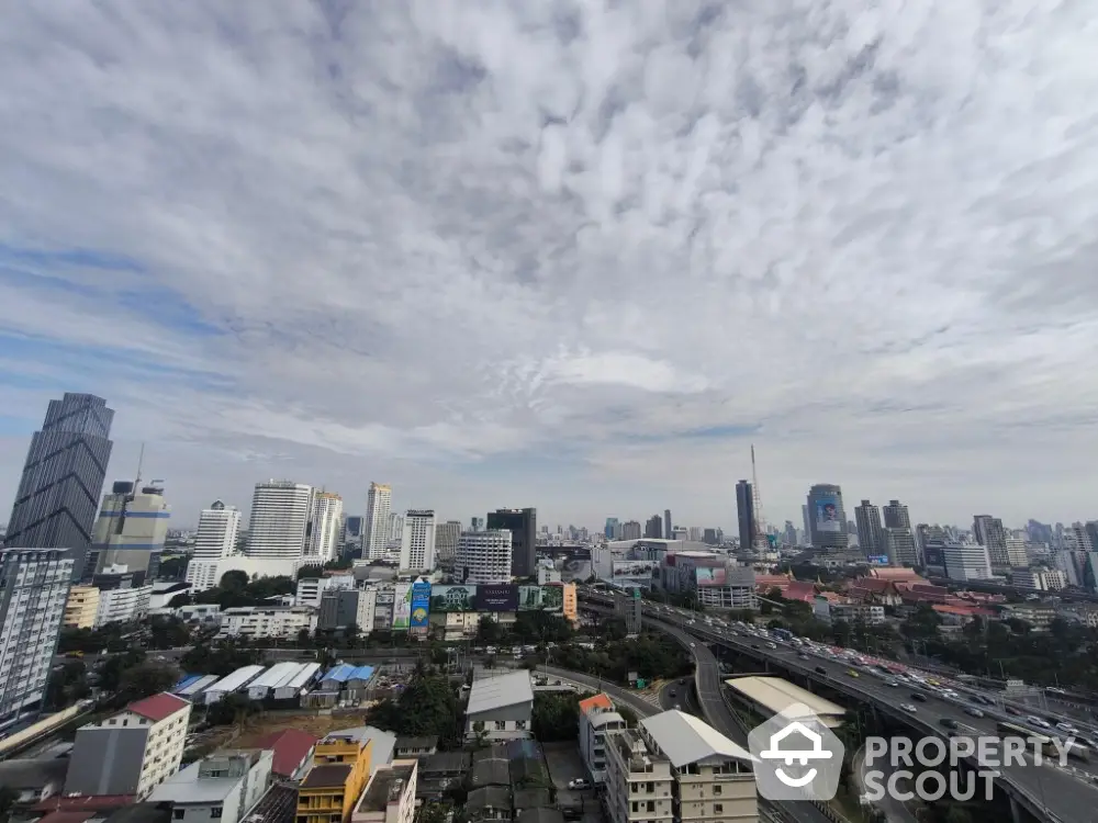 Stunning cityscape view showcasing urban skyline with high-rise buildings and expansive sky.