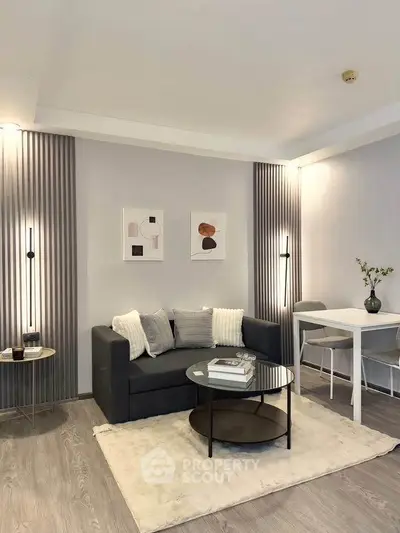Modern living room with stylish decor, cozy seating, and elegant lighting in a contemporary apartment.