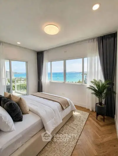 Luxurious bedroom with stunning ocean view and elegant decor