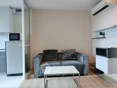 Modern living room with sleek gray sofa and minimalist decor