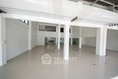 Spacious open-plan commercial space with high ceilings and modern design
