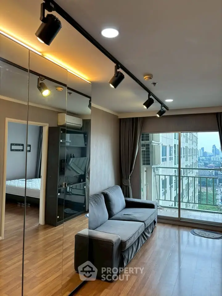 Modern living room with city view and stylish lighting in high-rise apartment