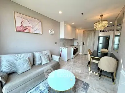 Luxurious modern living room with elegant decor and open kitchen layout