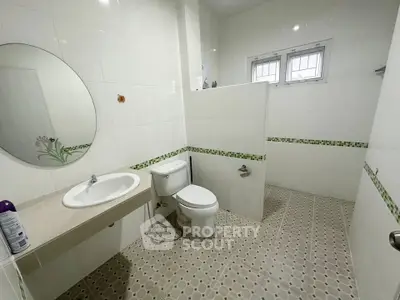 Spacious bathroom with modern fixtures and stylish tile design