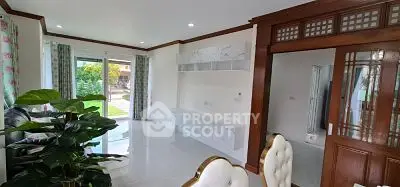 Spacious living room with elegant decor and garden view