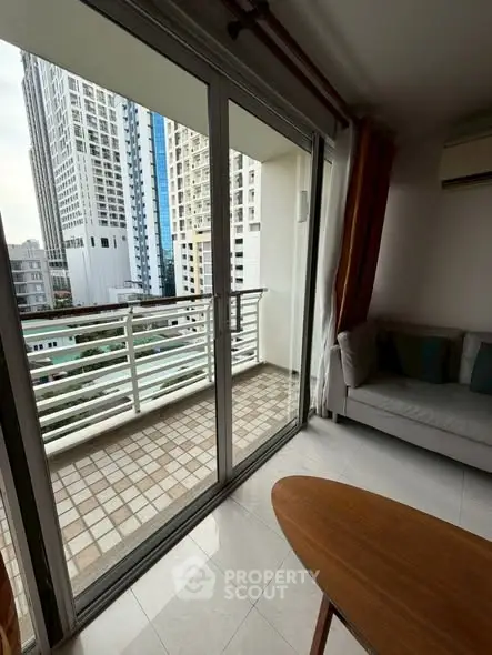 Modern apartment with balcony offering city views and stylish interior design.